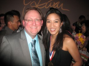 Michelle Kwan with a fan in a photo for the Manleywoman Skatecast, a figure skating podcast